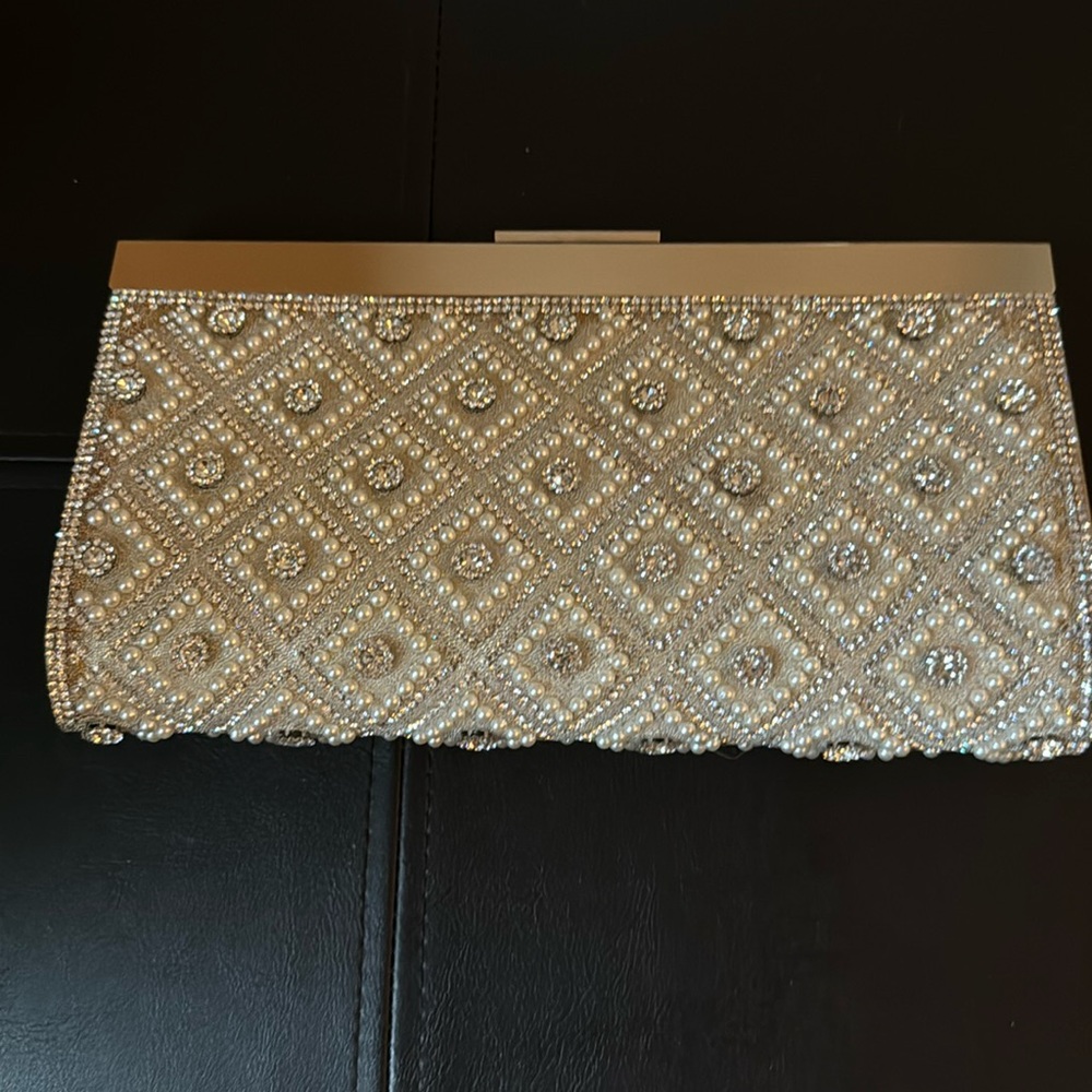 This bag was only used once, it’s in great condition. The color is a champagne.